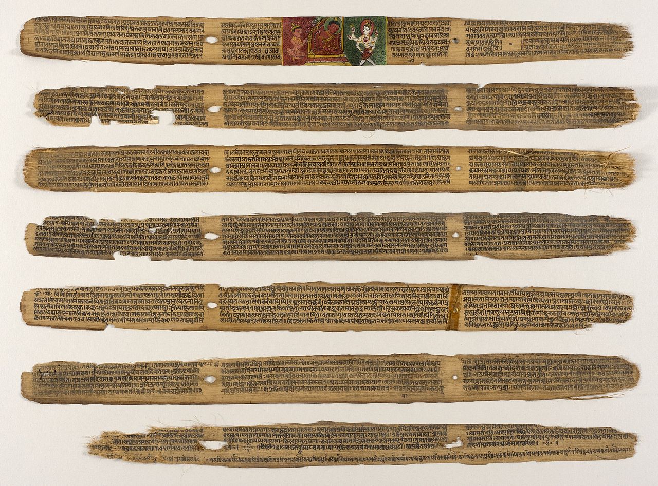 Seven dried palm leaves with drawings and Sanskrit writing